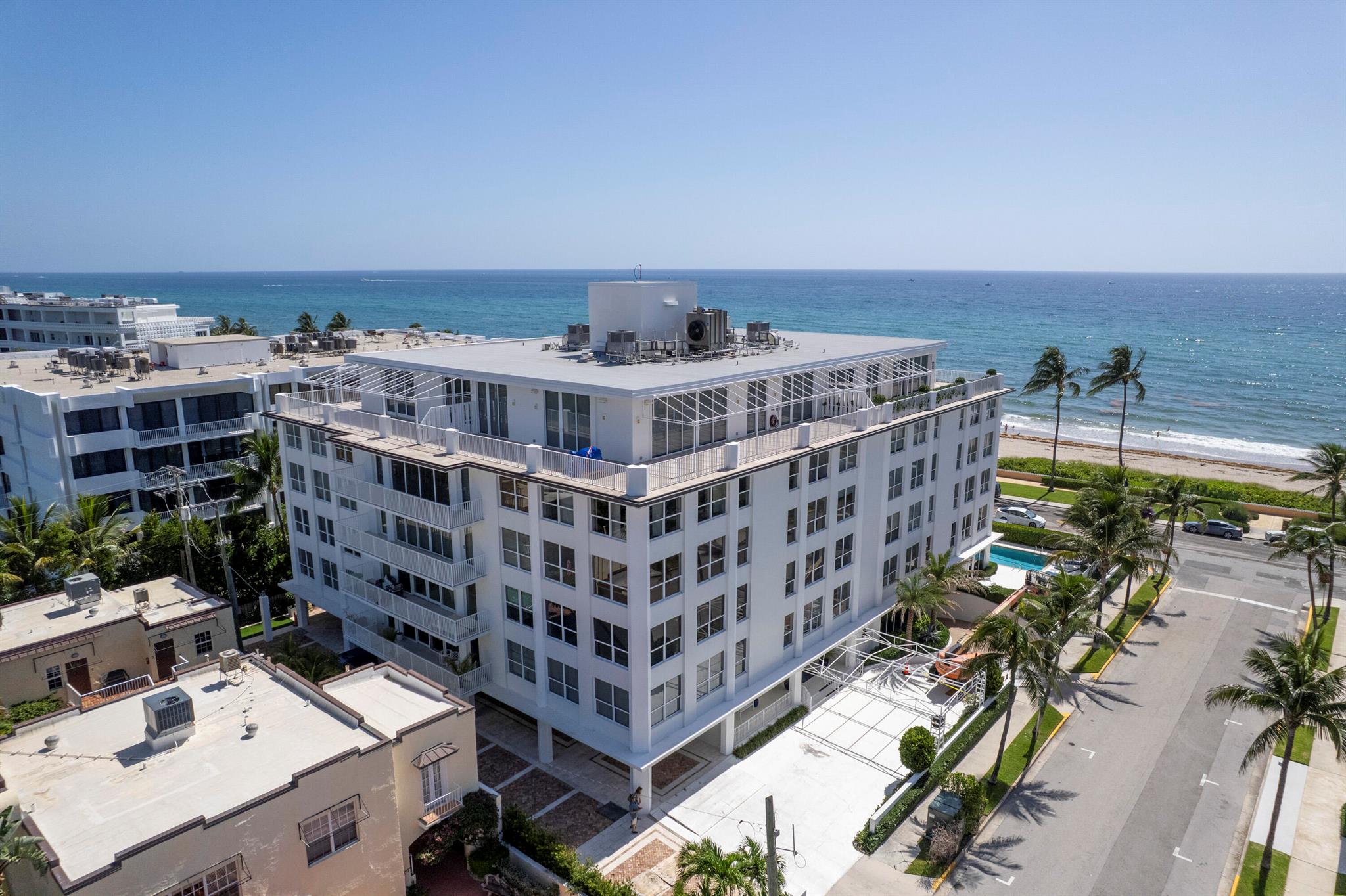 Rare opportunity to purchase this Timeless Two Bedroom, Two Bath, 4th floor condo unit in the Highly Desirable Lowell House! Boasting 2076 living square feet, high ceilings and a spaciously grand living room with oversized impact windows throughout. Enjoy bright eastern views of the ocean and south western views of the tropical tree lined streets of Palm Beach. Primary bedroom offers separate dressing room, large bathroom with walk-in shower and roomy walk-in closet. Guest bedroom offers sizeable walk-in closet. Kitchen offers spacious eat-in dining area. Stunningly well-maintained parquet flooring throughout all main living areas. This unit includes two garage parking space and a hall storage closet. Embrace the charm of retro design or elevate this condo to a dreamy...