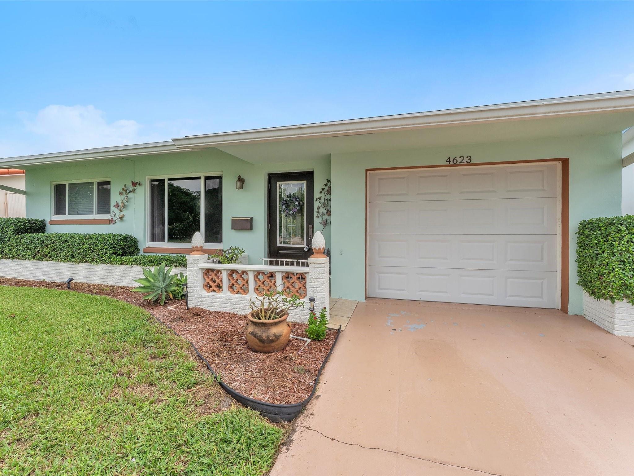 Welcome to this impeccably maintained 2-bedroom, 1-bath gem located in a peaceful 55+ community. This home offers the perfect blend of comfort, safety, and tranquility, making it ideal for relaxed Florida living. Enjoy peace of mind with hurricane impact windows throughout, including the garage and front door, as well as an updated electrical panel. The spacious Florida room provides stunning lake views, filling the home with natural light and serenity, perfect for morning coffee or quiet evenings watching the sunset. Step outside to your custom patio, surrounded by personalized landscaping designed to create a truly tranquil retreat. Whether entertaining or unwinding, the outdoor space is a true highlight. This move-in-ready home is a rare find, clean, spacious, and well-cared-for!