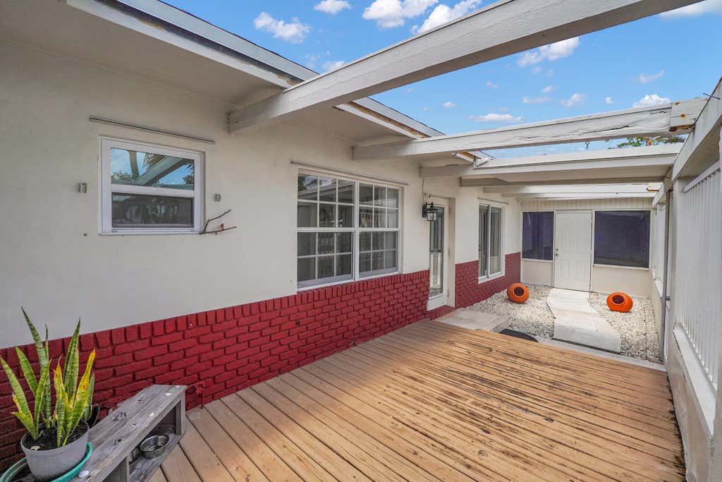 Photo of 555 NW 50TH Place, Boca Raton, FL 33431 (MLS # B26054603)
