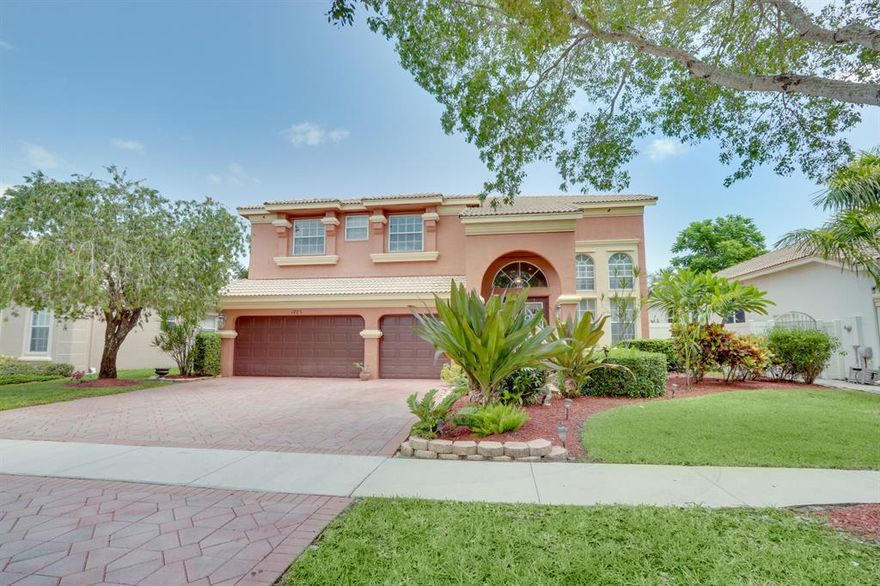 One of Madison Greens most highly desired floor plans.  This CBS home has over 4000sqft of beautiful living space.  24ft ceilings ceilings really add to the grand feel of this estate home.  A/C recently replaced inside and out.  Pool has also been refinished. Beautifully upgraded kitchen with maple cabinets, granite, stainless steel appliances and large walk in pantry.  This homes has tile and wood floors through out.  Inlaw suite on the first floor with private bathroom.  The backyard is perfect for entertaining with it's large pool with screen enclosure.  Large master bedroom with 2 walk in closets and huge master bathroom.  Freshly painted inside and out. Madison Green has some of the lowest HOA fee's in Palm Beach County with no Membership fee's and top rated Golf Course that is offered at a discounted rate.This home is also walking distance to the Club house, that has a huge heated pool, kiddie pool, tennis courts, basketball and club house.  Also close to turnpike, 95, downtown and the beach!  A-Rated School system.  Make an appointment to see this home today!