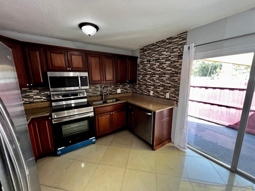 Photo of 4376 Lakewood Road, Lake Worth, FL 33461 (MLS # R10962777)