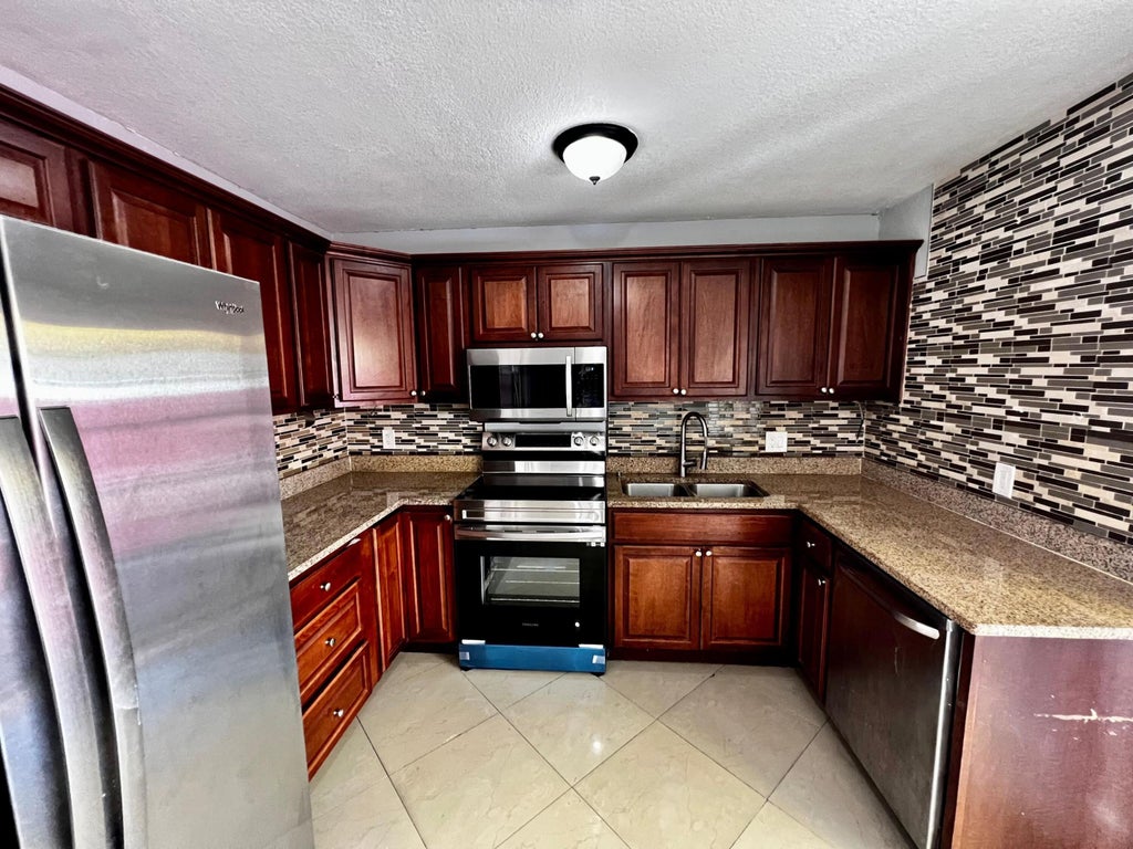 Photo of 4376 Lakewood Road, Lake Worth, FL 33461 (MLS # R10962777)