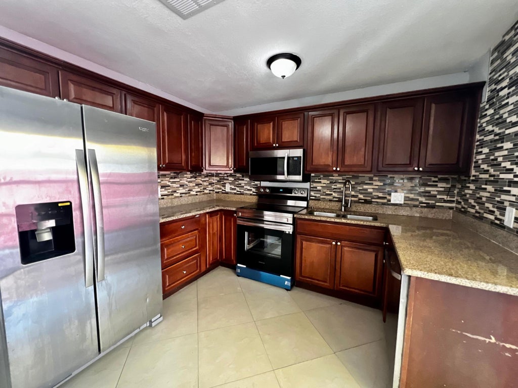 Photo of 4376 Lakewood Road, Lake Worth, FL 33461 (MLS # R10962777)
