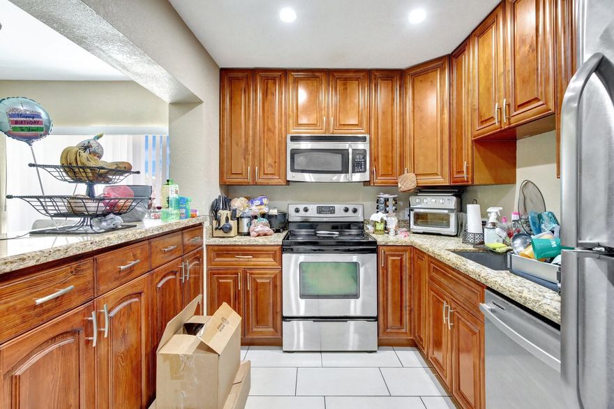 Charming 3/2 Villa in Sunrise Golf Village with the convenience of a detached garage & an extended driveway, offering ample parking & fenced. This home offers a bright and airy atmosphere with vaulted ceilings & an open-concept layout. The updated kitchen features modern cabinetry and countertops with stainless steel appliances. Wood floors in the bedrooms and tile thru-out the rest of the home. Both bathrooms have been tastefully renovated. The community amenities include a refreshing pool and tennis courts. Currently rented with reliable tenant of 9 years making it a perfect opportunity for investors. Centrally located near shopping, dining, schools, and major highways. Whether you're looking to expand your investment portfolio or secure a future home this property checks all the boxes.