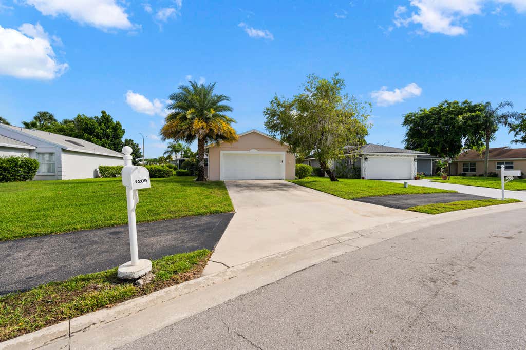 Photo of 1209 Pine Sage Circle, West Palm Beach, FL 33409 (MLS # B26062862)