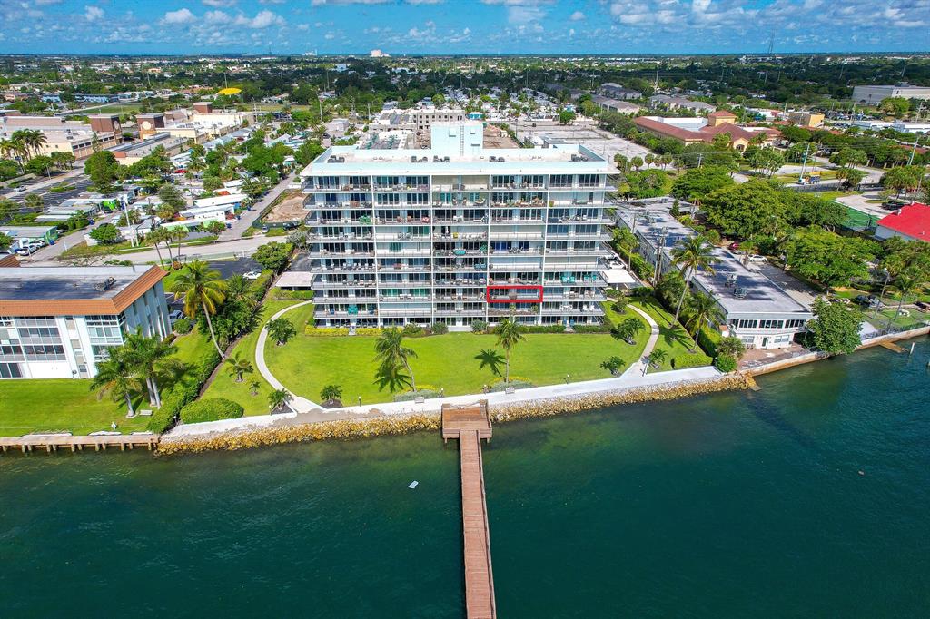 Immerse yourself in breathtaking views of the Intracoastal Waterway and Singer Island from this recently renovated condo. With 2 bedrooms and 2 bathrooms, this unit showcases a generously proportioned open floor plan and a private balcony accessible from both the primary bedroom and living room. The condo boasts exquisite tile flooring throughout, while the spacious kitchen is adorned with beautiful white shaker cabinets, stone countertops, and stainless steel appliances. Elevate your lifestyle with an exceptional range of amenities provided by this property. Take a refreshing plunge in the recently renovated pool, and make use of the community space which is perfect for entertaining guests.