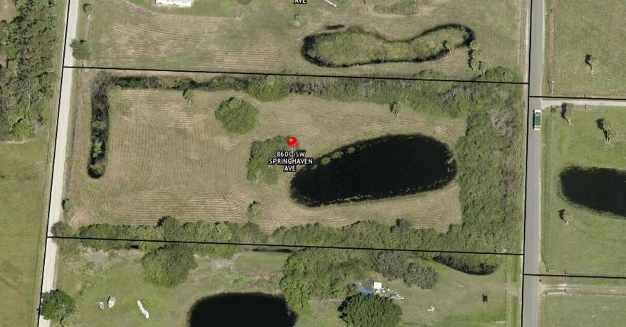 This stunning 4.9 acre property in the sought-after Springhaven Estates offers the perfect blend of rural charm and modern convenience. Located just off Hwy 710 in Martin County, this scenic lot features mature pastureland and a large, serene fishing pond, ideal for relaxation or outdoor activities. Surrounded by well-maintained homes on similar 5-acre parcels, it provides both privacy and a sense of community.Just 20 minutes from the beautiful Florida coastline, you'll enjoy easy access to local attractions like the renowned Jonathan Dickinson State Park, offering hiking, biking, and wildlife viewing. Nearby Indiantown and Okeechobee provide convenient shopping, dining, and recreational options, while the property's location offers a peaceful escape from the hustle and bustle.