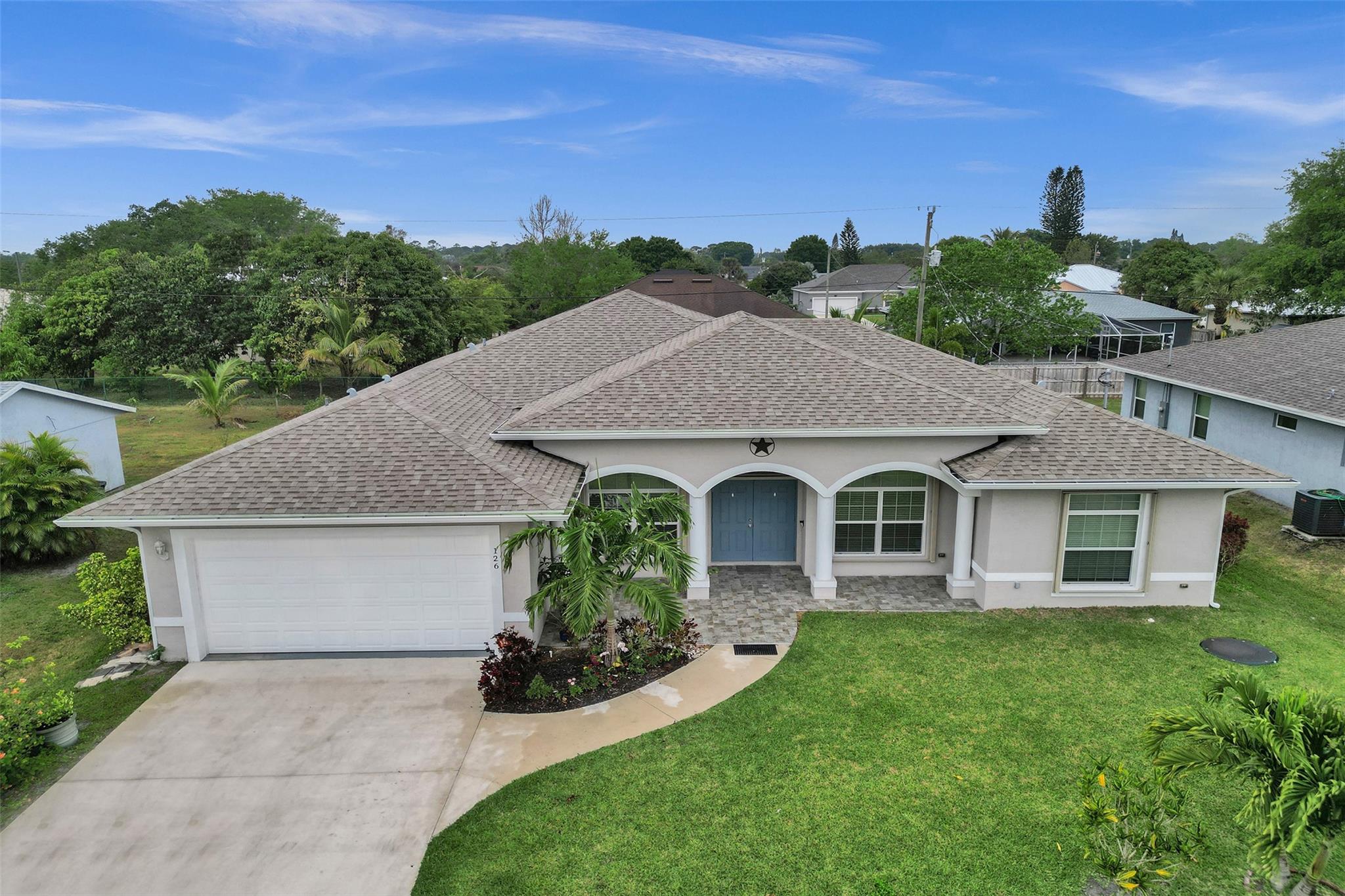 Discover this beautifully designed 3-bedroom, 2.5-bathroom home in the heart of Port St. Lucie! Built in 2020, this modern residence features an open-concept layout with a spacious den/office, perfect for remote work or a private retreat. The chef’s kitchen is a true showstopper, boasting granite countertops, stainless steel appliances, soft-close cabinets and drawers, and a large island with a farmhouse sink—ideal for entertaining. The cozy breakfast nook adds charm to your everyday meals. Step outside to the oversized screened-in patio, perfect for outdoor gatherings, while the expansive backyard offers ample space to add a pool and create your dream oasis. No HOA!! Close proximity to all your favorite beaches, shopping, and entertainment needs. Hurry, this home won't last.