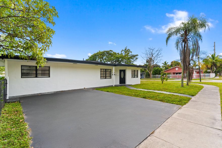 Lowest-priced renovated single-family home on the market and the largest corner lot available under 600k! An exceptional opportunity for a first-time buyer or an income-producing investment.  This beautifully updated home features new tile flooring throughout and a split-bedroom floor plan. The spacious primary suite offers a walk-in closet and a brand-new, modern bathroom. Two additional bedrooms are generously sized, while a fourth bonus bedroom is perfect for bunk beds, a kids' room, home office, or creative flex space. Tankless water heater and a/c are 2022.  The open-concept kitchen showcases quartz countertops, stainless steel appliances and a sizable dining area. No HOA! Set on an oversized corner lot, the property offers ample room for future expansion including the potential for a mother-in-law suite, home addition, pool, shed, or outdoor entertaining areas. The fully fenced yard is enhanced with newly planted privacy hedges that will mature to approximately 6 feet tall, creating a private and serene outdoor oasis. So much space, so many possibilities.  Perfectly situated for South Florida living, the beach, Wynwood, Midtown, Bal Harbour, Brickell, Downtown Miami, Hardrock Stadium, Kaseya Center, Miami Airport are all within 11 miles or much less.