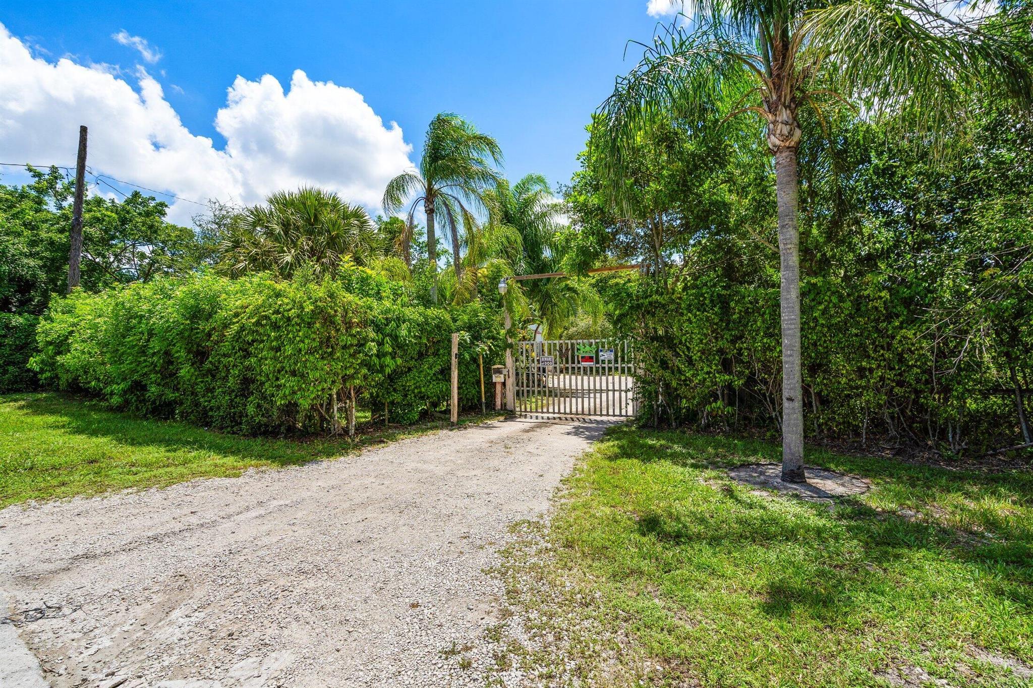 MASSIVE PRIVATE FENCED IN BACK YARD - GREAT LOCATION - NO HOA! This spacious 1 bedroom unit is nicely located just 4.5 miles from Lake Worth Beach! Close to churches and great schools, and a short drive to downtown West Palm Beach, Palm Beach International Airport and Palm Beach Proper! This unit has tile floors, a spacious bedroom, good closet space and an abundance of natural light. The community is very quiet and being improved continuously. This is an extremely versatile space with plenty of parking and a massive private, fenced in yard. Access to the large canal.