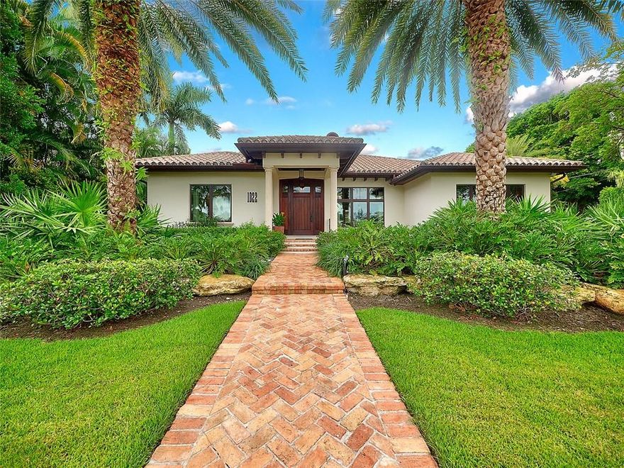 Stunning East Delray Luxury Home nestled on a generous corner lot overlooking an expansive intracoastal basin. Walking distance to the beach and all there is to offer on Atlantic Avenue. Attention to details at every turn in this designer inspired home. From wide plank European oak floors to hand laid mosaic tiles, no expense was spared to make this a warm and livable residence which is equally suited for deep relaxation or lively entertaining. The highest quality workmanship and materials are evident throughout and make this highly efficient and low maintenance home very desirable. Private back yard surrounds a gorgeous free form pool and spa. 100 ft waterfront, 90 feet of dock and 20,000 lbs rated boat lift this location is ideal for a short boat ride to the ocean. A MUST SEE