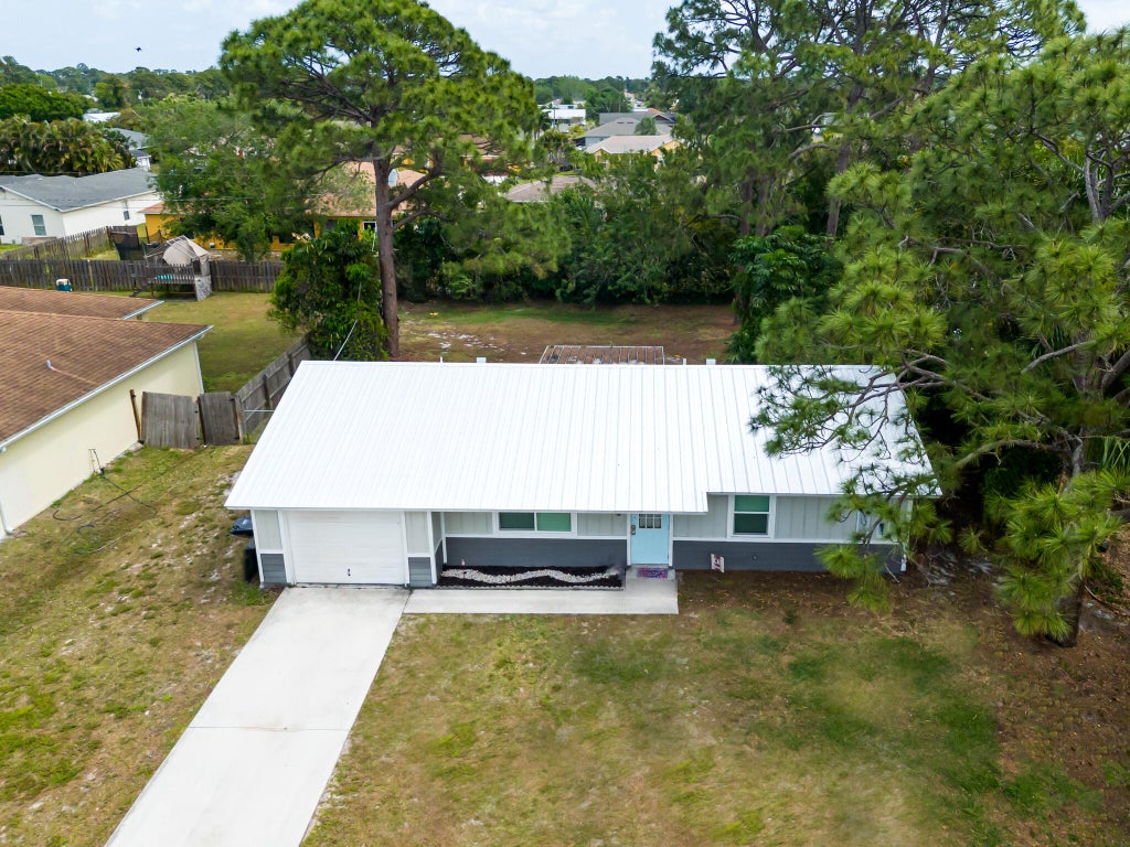 Photo of 1619 SE Trumpet Lane, Port Saint Lucie, FL 34983 (MLS # R11058208)