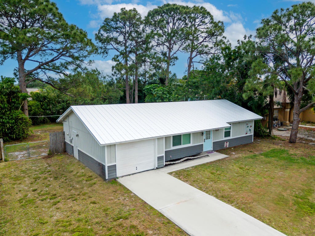 Photo of 1619 SE Trumpet Lane, Port Saint Lucie, FL 34983 (MLS # R11058208)