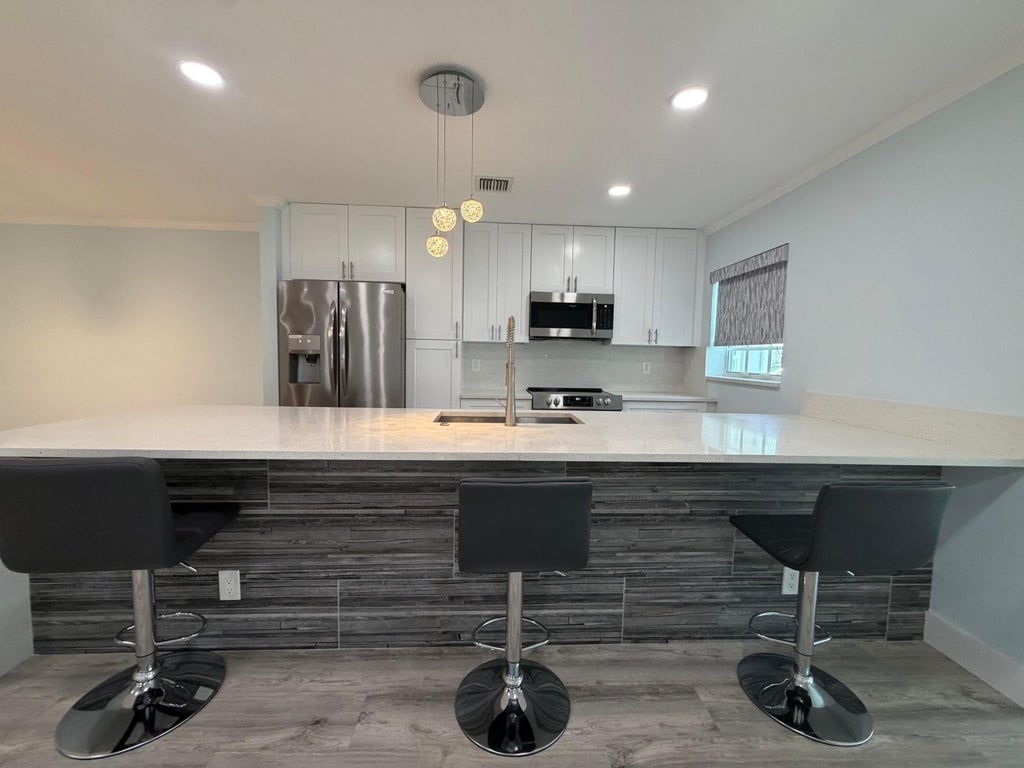 Photo of 14516 Canalview Drive #B, Delray Beach, FL 33484 (MLS # B26079918)