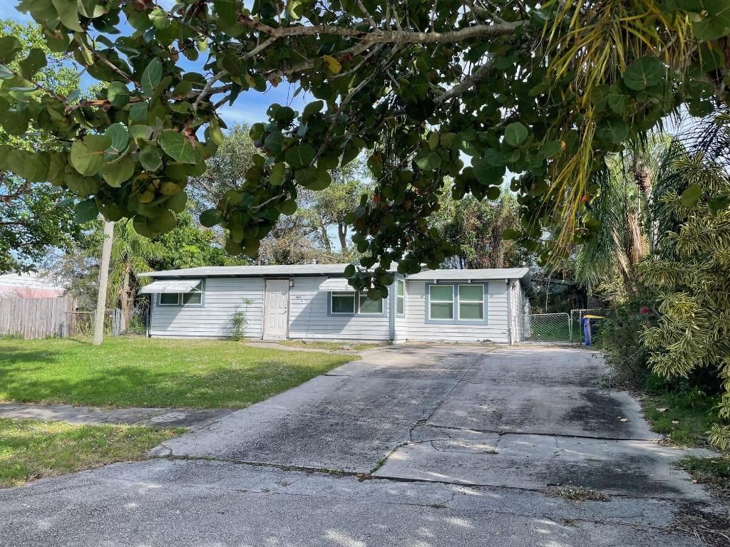 Photo of 1405 NE Waveland Avenue, Jensen Beach, FL 34957 (MLS # R10954059)