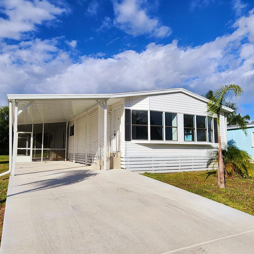 Photo of 188 W Caribbean, Port Saint Lucie, FL 34952 (MLS # R11032547)