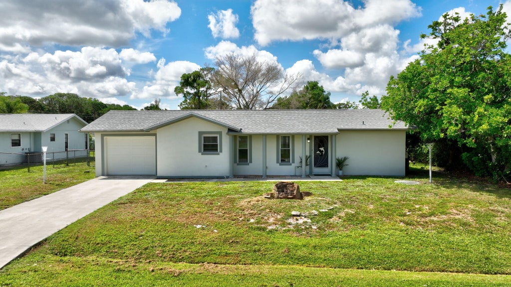 Photo of 592 SW Banks Terrace, Port Saint Lucie, FL 34953 (MLS # B26042079)