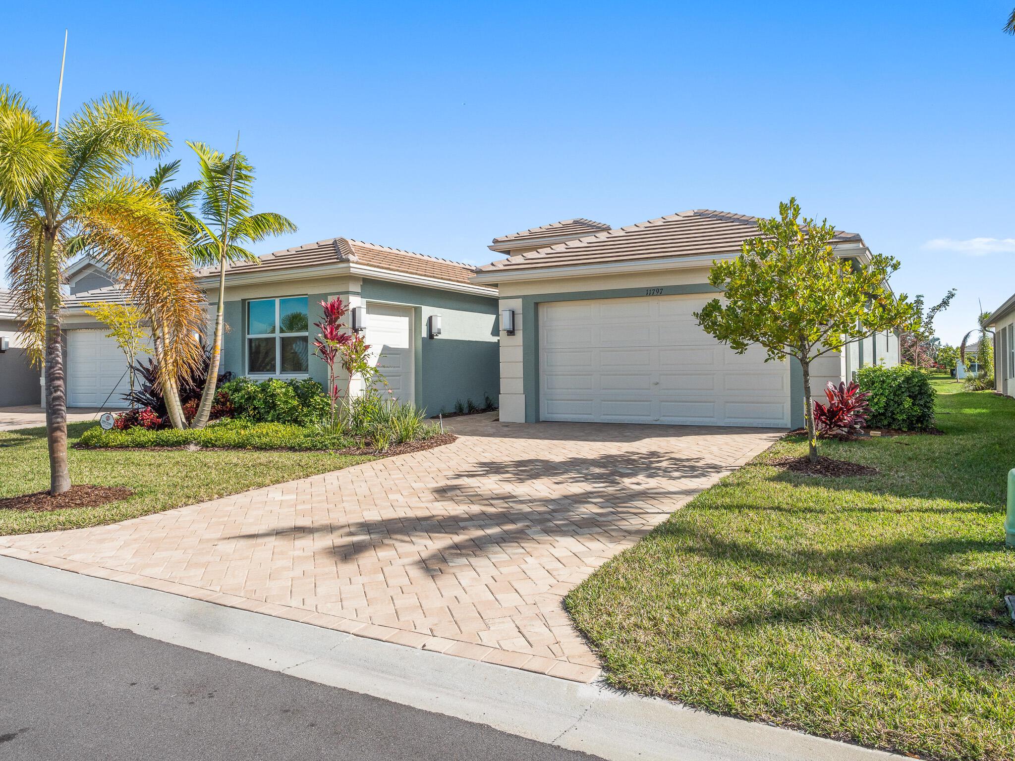 Welcome to your dream home in Valencia Grove Riverland. An exceptional blend of luxury, comfort, and modern living. Just hit the market! This stunning Bimini model offers four spacious bedrooms, three beautifully appointed bathrooms on a premium lake-front lot. Open-concept design creates an inviting atmosphere with abundant natural light. All the benefits of Natural Gas to reduce utility bills, impact rated windows and sliders, energy efficiency, home security. A chef's delight, the kitchen features state-of-the-art appliances, a large island, counter seating, exceptional cabinetry. Designed for Florida living at its finest. Water view, screened lanai, extended patio. Perfect for enjoying a morning coffee or hosting a summer barbecue. Two-car plus golf cart garage.