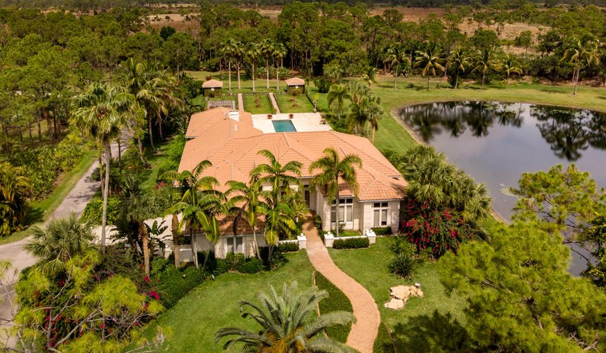 Stunning Estate home on over 21 acres of prime property, Electric Gates can be controlled remotely. Long winding driveway with bridge over a lake.This home is a perfect size, 4259 under air total sf 7288 4 bedroom and 3.1 baths in the main house with a CBS barn that has a full bath and could be a guest house. The garage also has a bay that's AC for a extra guest room, a project room or a car! This serene setting is nature at it's best. Here is your own estate where you can have your horse on the property in a very nice concrete barn which is 1620 SF, this could be a guest house. The property backs up to 3800 acres of preserve which will never be built on. The pool area is amazing with a large lap pool that is landscaped and has a pergola over the outside entertaining area. 21.66 acres of the best land available in Ranch Colony ( very small area in front SW corner of property is wetland) Fruit trees mature Pines and Palms on this professionally landscaped, fully irrigated land. Since the property backs up to preserve there is total privacy! Nothing will ever be built behind this home.
Home also has speakers and a sound system. The patio is very large with coquina stone with a lengthy pergola and a wall fountain for outside dining. Brick paved walks lead to cabana bldgs that match the architecture of the home. If you are looking for that special property you will want to see this today!