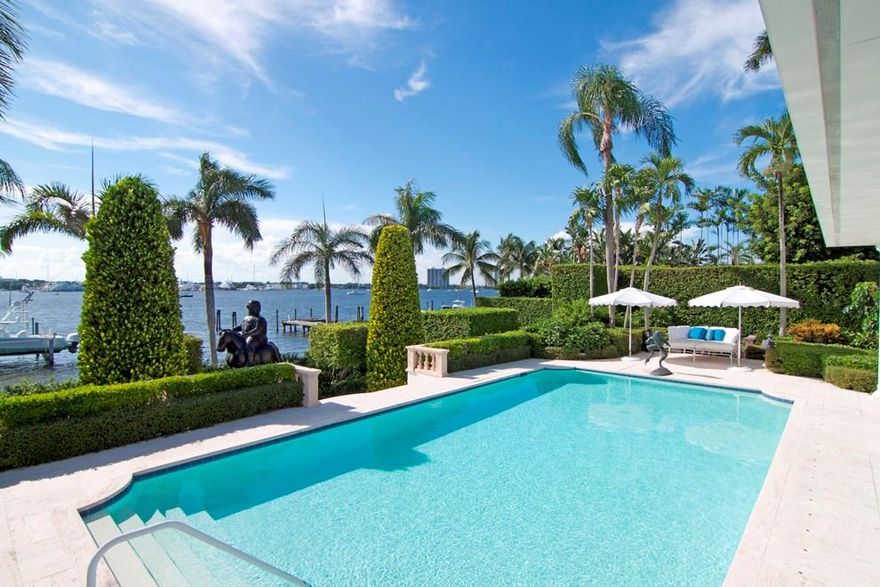 Palm Beach on the Intracoastal with deep water dock! Large lot with rare high elevation. Elegant Gottfried Regency style home on large lakefront lot featuring a first floor master suite + 2 additional first floor en-suite guest rooms, 5 upstairs guest rooms.  A beautiful 50' x 24' pool and a cabana with a full bath grace the lakefront.