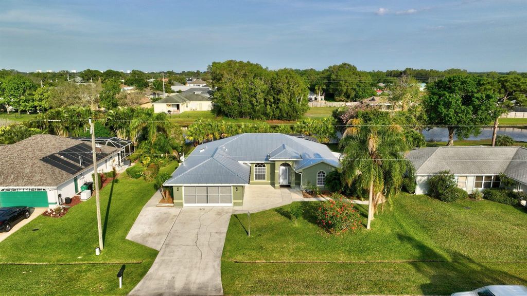 Photo of 2537 SE Hallahan Street, Port Saint Lucie, FL 34952 (MLS # R10968214)