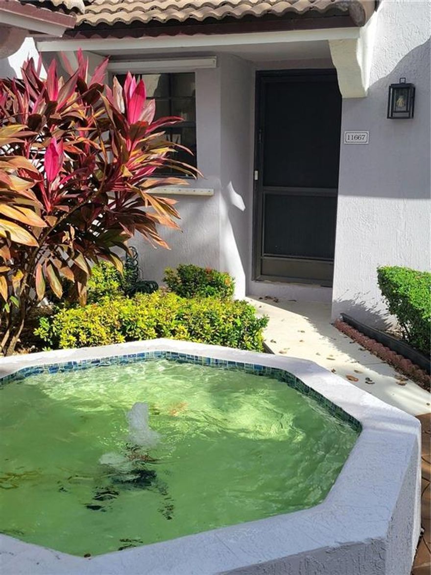 Quaint 2/2 corner villa located in the heart of Pembroke Pines in the Pierpointe community. Property boasts a garden courtyard with two entrances. Newer white PVC fencing with a separate entrance to the unit encloses the rear patio area. Patio has ample space for entertaining. Vaulted ceilings, fresh exterior paint, parking lot recently resurfaced, new roof 2021, washer and dryer, and a community pool. Bring your creativity and make this place your own!!!! Great location, close to Memorial Hospital west , CB Smith Park, Pembroke Lakes Mall, and major highways. HOA fees includes: exterior maintenance, water, trash, sewer, pool, security.