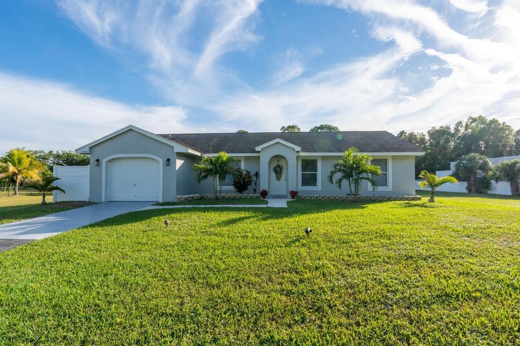 Photo of 14702 Key Lime Boulevard, Loxahatchee, FL 33470 (MLS # R10942809)
