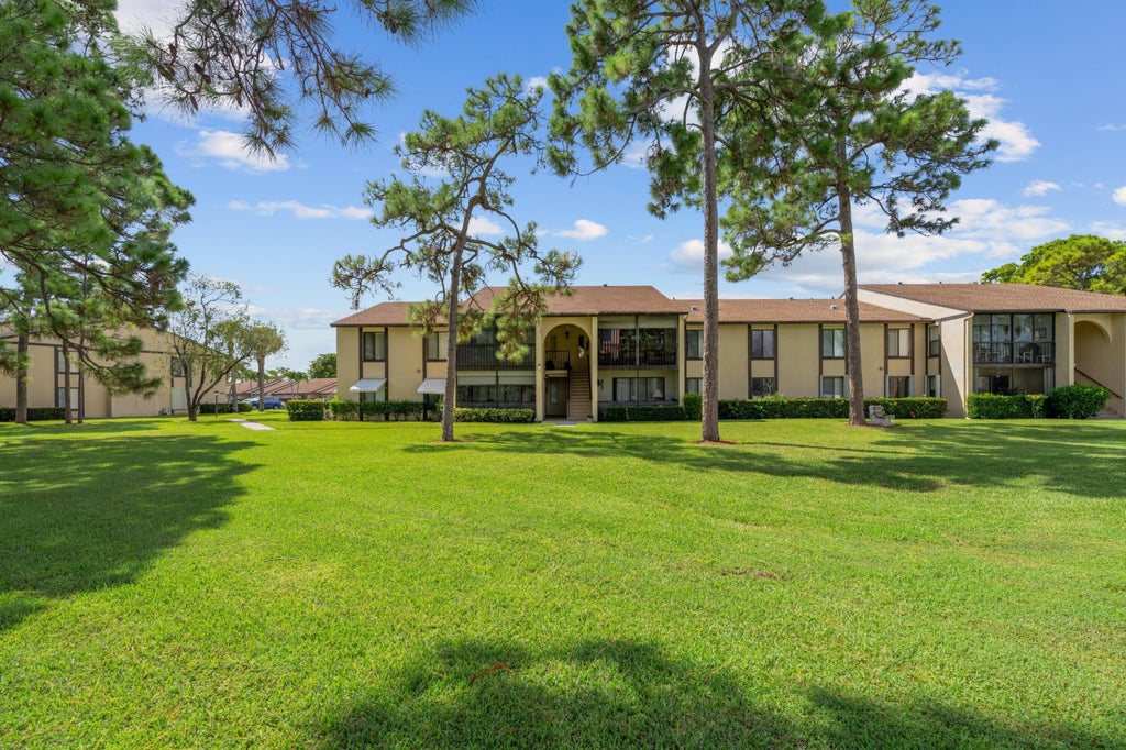Photo of 801 Sky Pine Way, Greenacres, FL 33415 (MLS # B26088798)