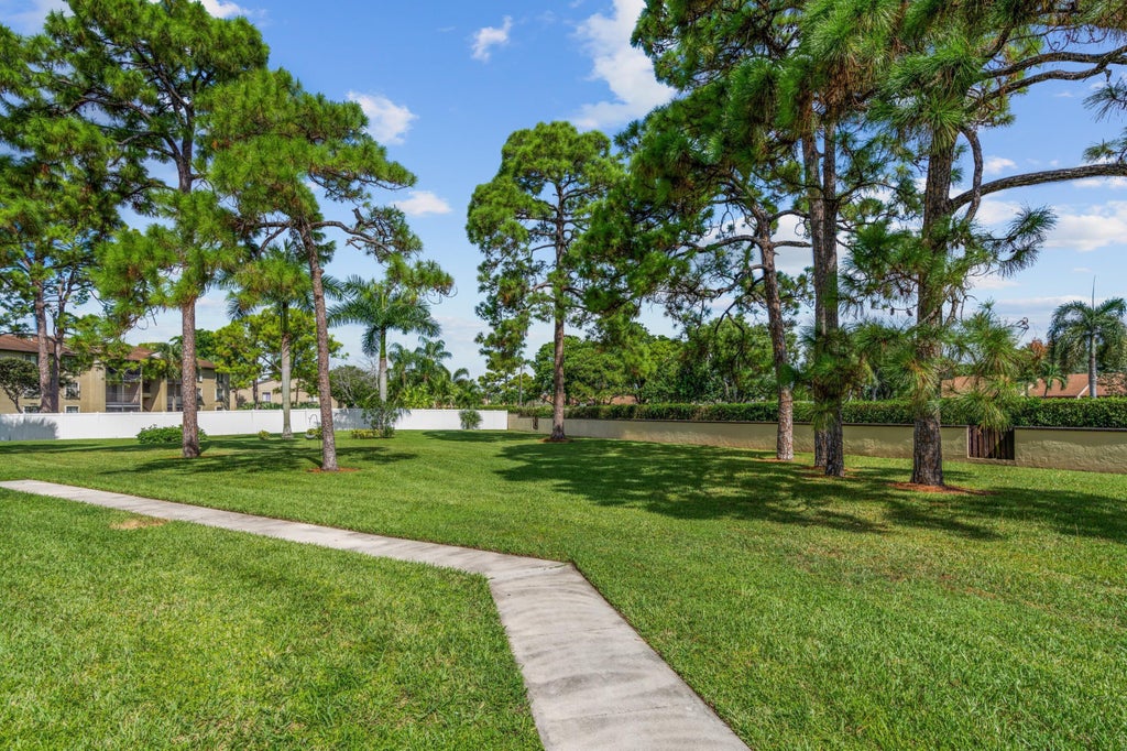 Photo of 801 Sky Pine Way, Greenacres, FL 33415 (MLS # B26088798)