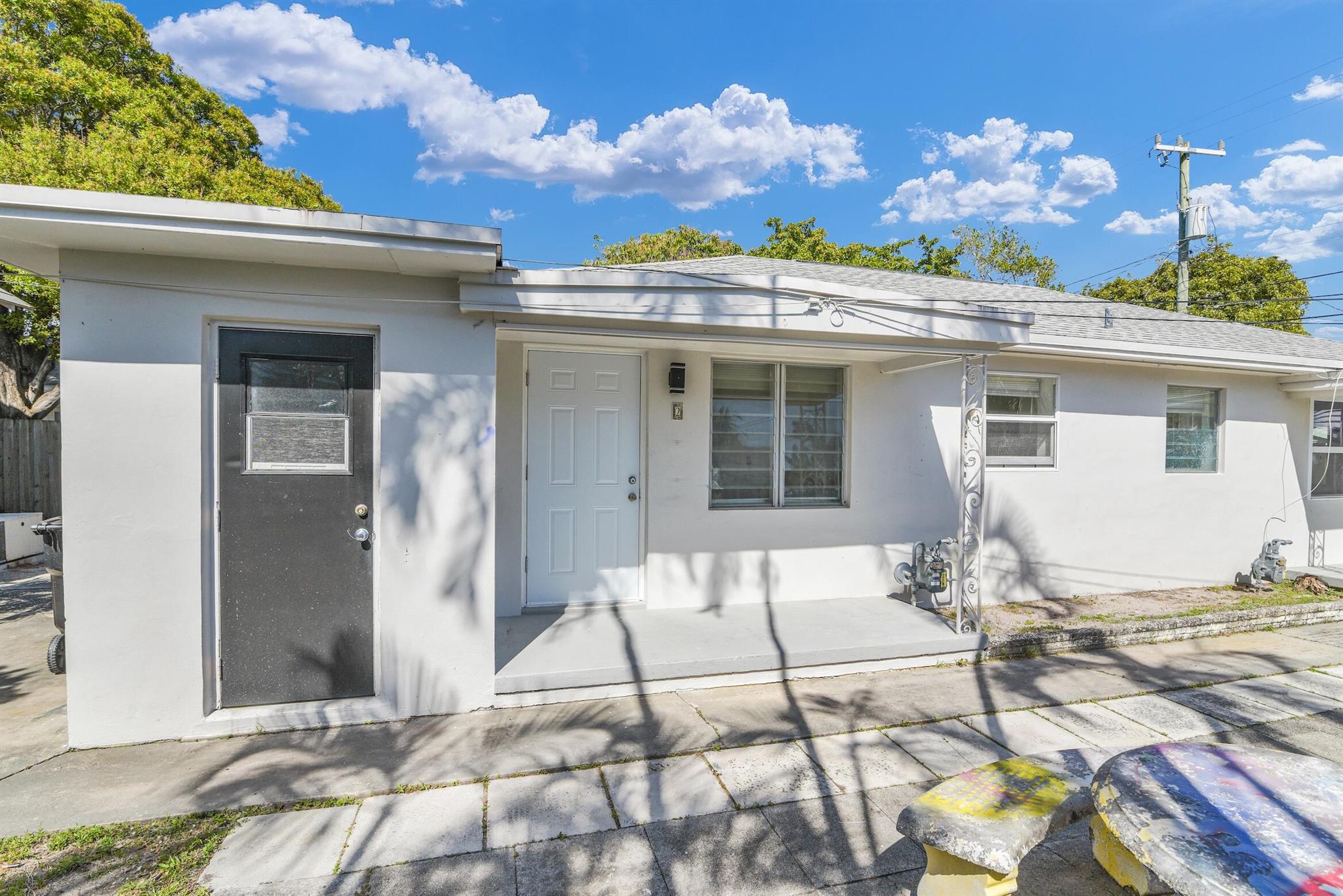 Charming and newly renovated 1-bedroom, 1-bathroom unit in the heart of Lake Worth Beach! This bright and airy home features a fresh modern design with new paint, sleek floors, and an updated kitchen with stylish white cabinetry and gas stove. The spacious living area is filled with natural light, while the beautifully updated bathroom boasts elegant tile work and contemporary finishes. Enjoy the convenience of a prime location just minutes from downtown, beaches, shopping, and dining. Water and sewer included. Fast approval process