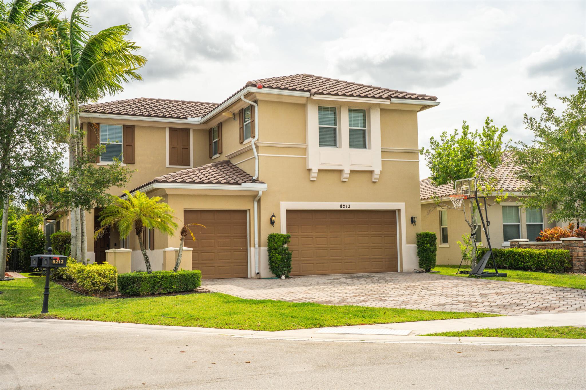 Property taxes exclude the homestead exemption. Stunning 5BR/4BA pool home in guard-gated Heron Bay, fully refurbished inside and out with fresh paint completed 07/23/25. Set on a quiet, tree-lined street with lush landscaping and standout curb appeal. Features an open layout with soaring ceilings, abundant light, and a gourmet kitchen with granite counters, stainless steel appliances, large island, and ample cabinetry. Enjoy water or garden views from most rooms. The spacious primary suite offers a spa-style bath, dual walk-ins, and patio access. Private backyard with heated pool, covered lanai, and no rear neighbors. Includes 3-car garage, impact windows/doors, shutters, guest suite, and office/flex room. Resort-style amenities, A+ schools, 24/7 security