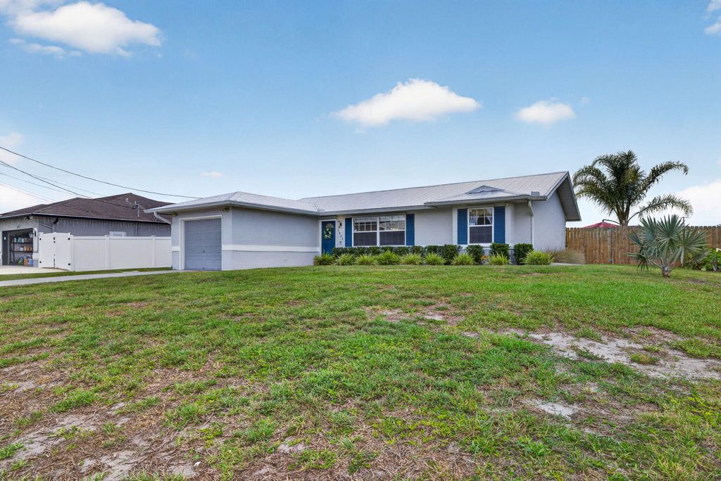 Photo of 1031 SW Idol Avenue, Port Saint Lucie, FL 34953 (MLS # B26026405)