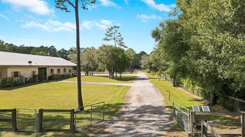 Photo of 18480 Windsong Way, Jupiter, FL 33478 (MLS # R10930561)