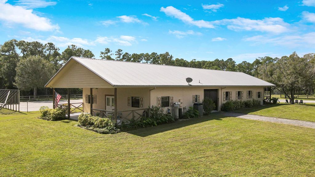 Photo of 18480 Windsong Way, Jupiter, FL 33478 (MLS # R10930561)