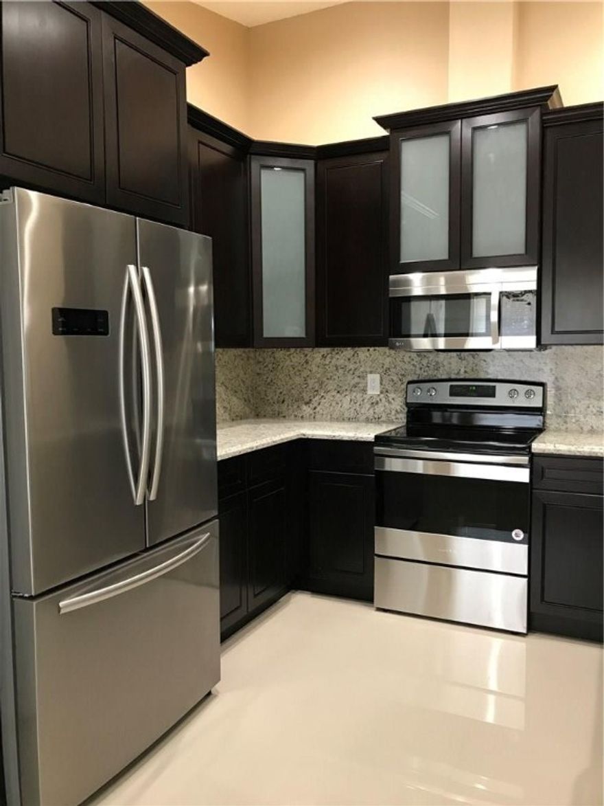 PRICED TO SELL! MOTIVATED SELLER! BEAUTIFULLY RENOVATED 3/2 HOME. KITCHEN FEATURES TOP OF THE LINE LINE SLOW CLOSE 42'' EXPRESSO WOOD CABINETS. GRANITE COUNTERTOPS AND FULL GRANITE BACKSPLASH.SS APPLIANCES. BREAKFAST BAR AREA.24X24 PORCELAIN TILES WILL TAKE YOUR BREATH AWAY UPON ENTERING. FULLY REMODELED GUEST AND MASTER BATH WITH CUSTOM VANITY AND MARBLE THROUGHOUT. NEW A/C UNIT, NEWER WATER HEATER, FRESHLY PAINTED INSIDE AND OUT. NEW SOD. NEW SPRINKLER SYSTEM. READY FOR A FAMILY TO MAKE IT THEIR OWN!