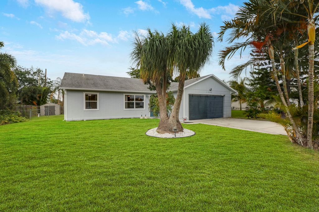 Photo of 1042 SW Coleman Avenue, Port Saint Lucie, FL 34953 (MLS # R10976461)