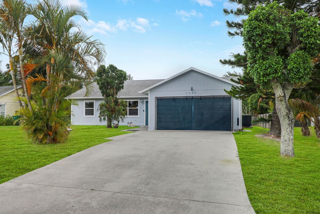 Photo of 1042 SW Coleman Avenue, Port Saint Lucie, FL 34953 (MLS # R10976461)