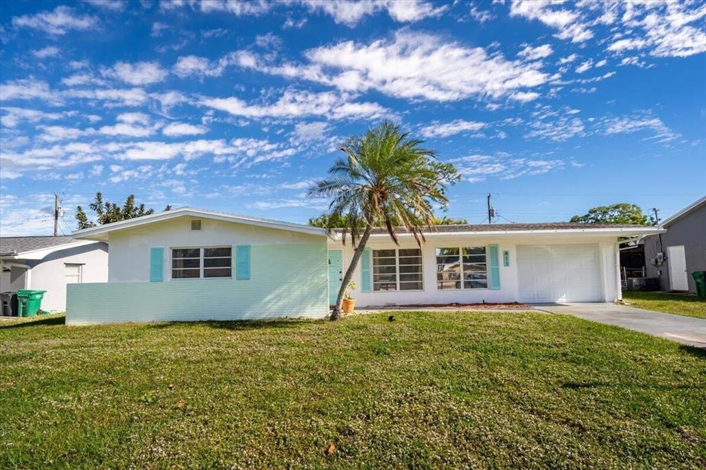 Photo of 411 NE Oleander Avenue, Port Saint Lucie, FL 34952 (MLS # R10768358)