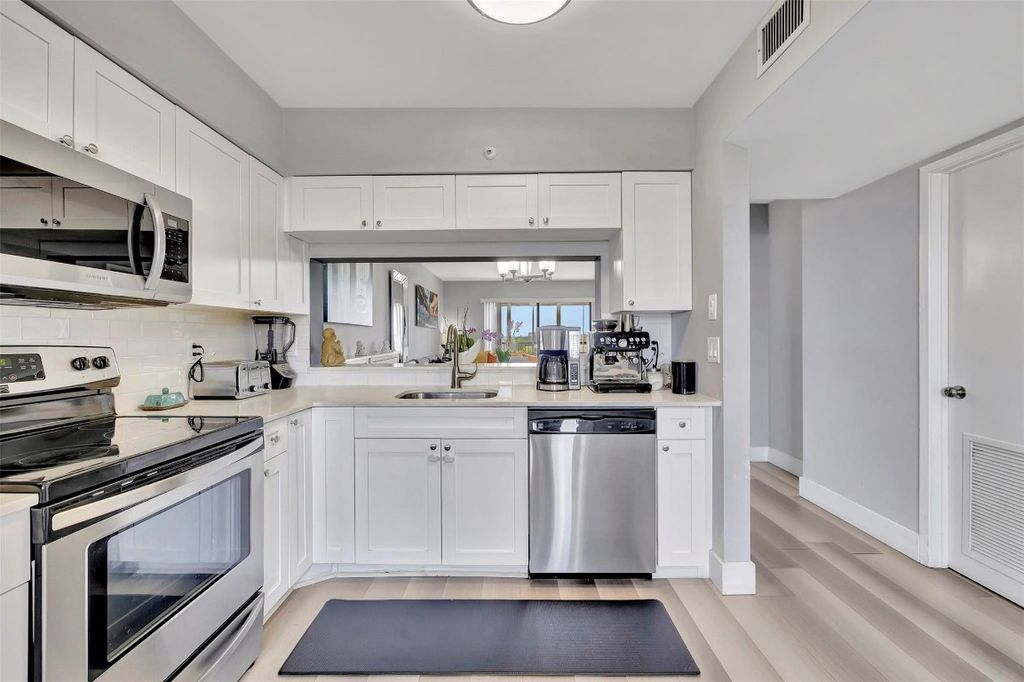 Photo of 2200 S Cypress Bend Drive #702, Pompano Beach, FL 33069 (MLS # F10507252)