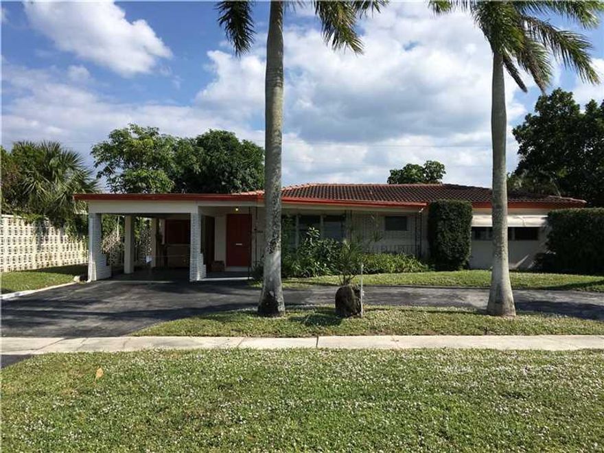 Beautiful single-family home in East Boca Raton with an open floor plan, a Florida room, plenty of storage, a large fenced backyard with mango trees and a BBQ area, freshly painted inside and out, located near great schools in a desirable area just one block from Federal Hwy and 5 minutes from the beach and Mizner Park.