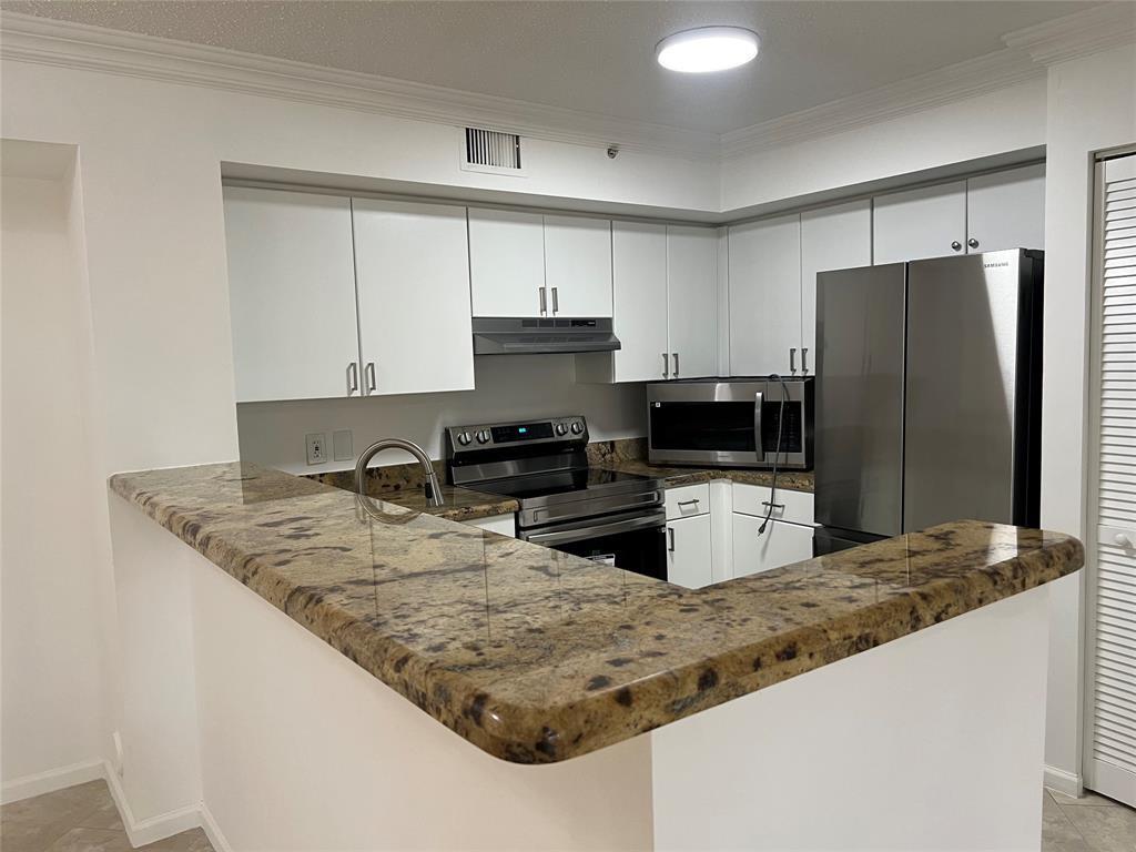 !!!!TOTALLY REMODLED FIRST FLOOR UNIT,NEW STAINLESS STEEL APPLIANCES,FRESHLY PAINTED INTERIOR,A/C APPROX 1 YEAR OLD,NEW LIGHT FIXTURES,NEW WASHER AND DRYER,NEW BATHROOM VANITIES,NEW VINYL TILE IN BOTH BEDROOMS,NEW CLOSET SHELVING IN ALL CLOSETS,NEW WINDOW BLINDS,HURRICANE SHUTTERS,ALLGROUT PROFESSIONALY CLEANED,,NEW GARBAGE DISPOSAL,PATIO AND WINDOWS PRESSURE CLEANED!!!