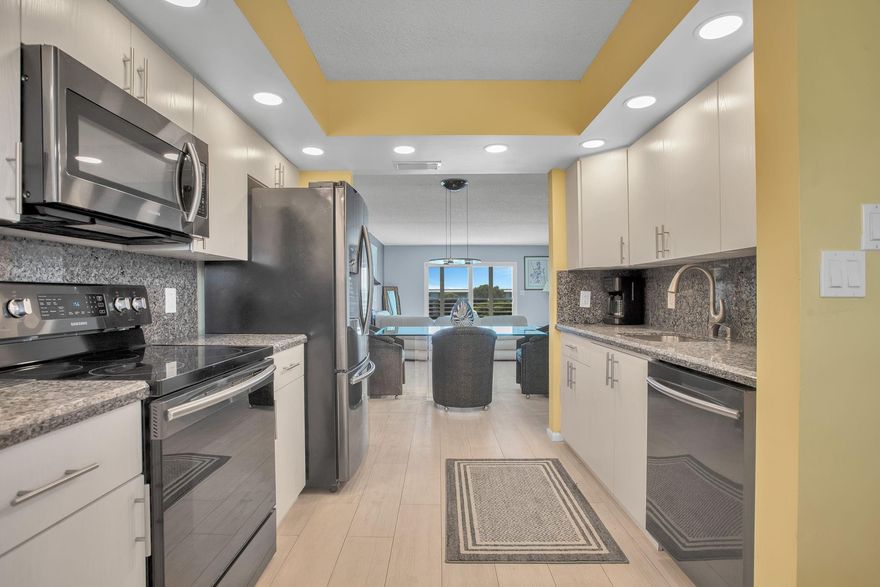 TOTALLY REMODELED 'IRIS' FLOOR PLAN; IMPACT WINDOWS, FRONT DOOR AND INTERIOR SLIDING IMPACT DOORS, KITCHEN AND BATHROOMS REMODELED 2017. NO CARPET. NEWER AC 2024, WATER HEATER 2017. STAINLESS STEEL APPLIANCES, TURN KEY FURNISHED JUST BRING YOUR TOOTHBRUSH AND BATHING SUIT. ALL CUSTOM WINDOW TREATMENTS PLANTATION SHUTTERS. MAGNIFICENT SUNSETS PANORAMIC UNOBSTRUCTED WATER AND VILLAGE POOL VIEWS. SEE ALL PHOTOS THEN SEE FOR YOURSELF. VACANT