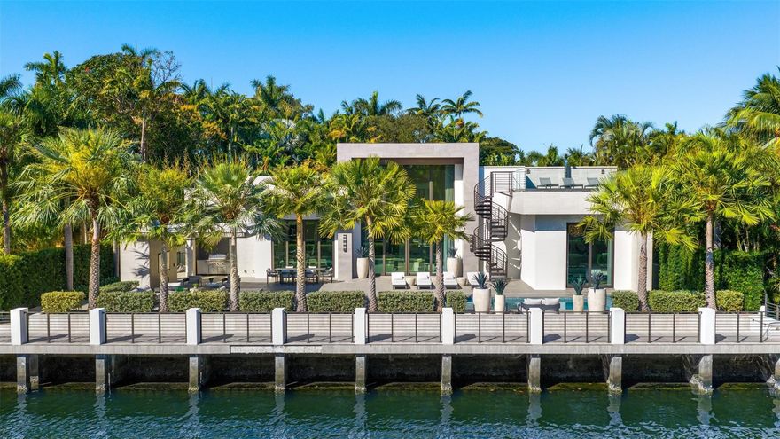 Positioned one home off the point in Fort Lauderdale’s sought after Las Olas Isles, this fully gated modern one-story custom waterfront residence offers 100 feet of water frontage and an exceptional South Florida setting. With no fixed bridges and direct, quick access to the Intracoastal, it is ideal for serious boaters and effortless waterfront living. Built by highly reputable builder Jeff Hendricks, the home showcases 21' ceilings in the great room and 15' ceilings in the kitchen. The well-designed layout includes an office, gym, cabana bath, and a two-car garage with 15' ceilings allowing room for lifts. A roof deck with outdoor shower adds another elevated retreat. Walk to Las Olas Boulevard, dining, shopping, and the beach.