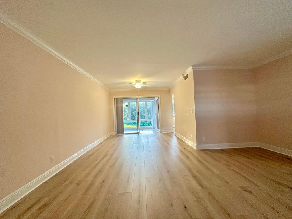 Photo of 33 Colonial Club Drive #203, Boynton Beach, FL 33435 (MLS # B26016637)