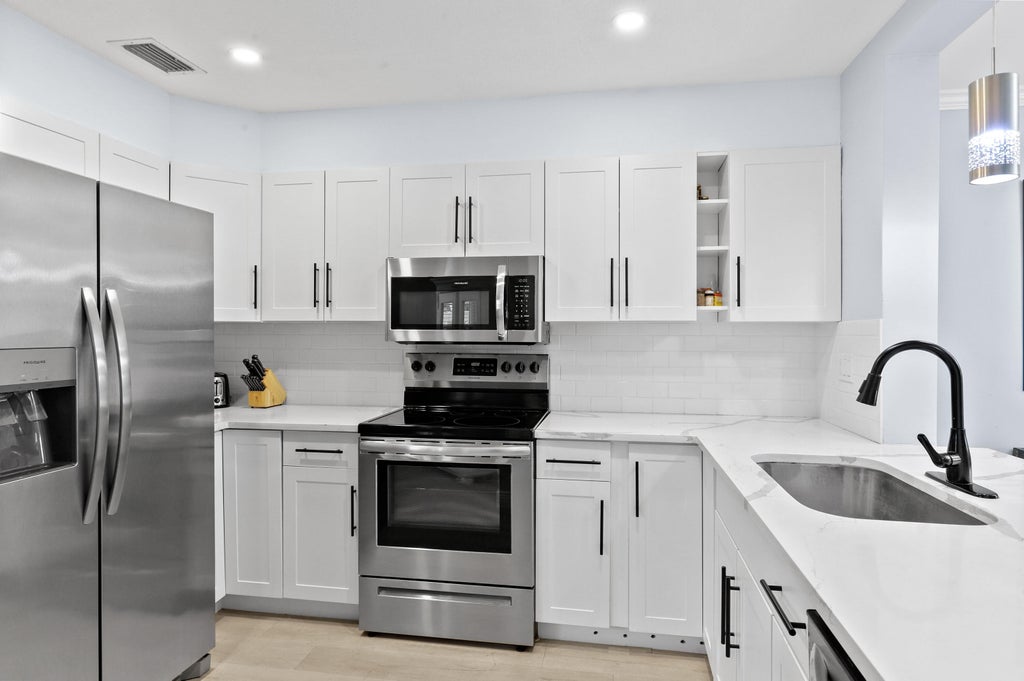 Photo of 111 Ocean Dunes Circle, Jupiter, FL 33477 (MLS # R11105758)