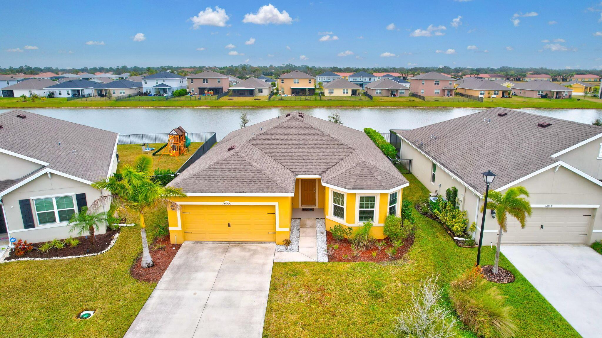 Located in the heart of Port St. Lucie, this home offers breathtaking lake views, providing a tranquil and picturesque setting to enjoy every day. Conveniently located near shopping, dining, and entertainment options, including Tradition Square, this property is ideal for those seeking a vibrant lifestyle. Outdoor enthusiasts will enjoy the nearby parks, walking trails, and community events. With easy access to I-95, commuting is simple and convenient. Don't miss your chance to live in this exceptional lakefront home in one of Port St. Lucie's most desirable communities.