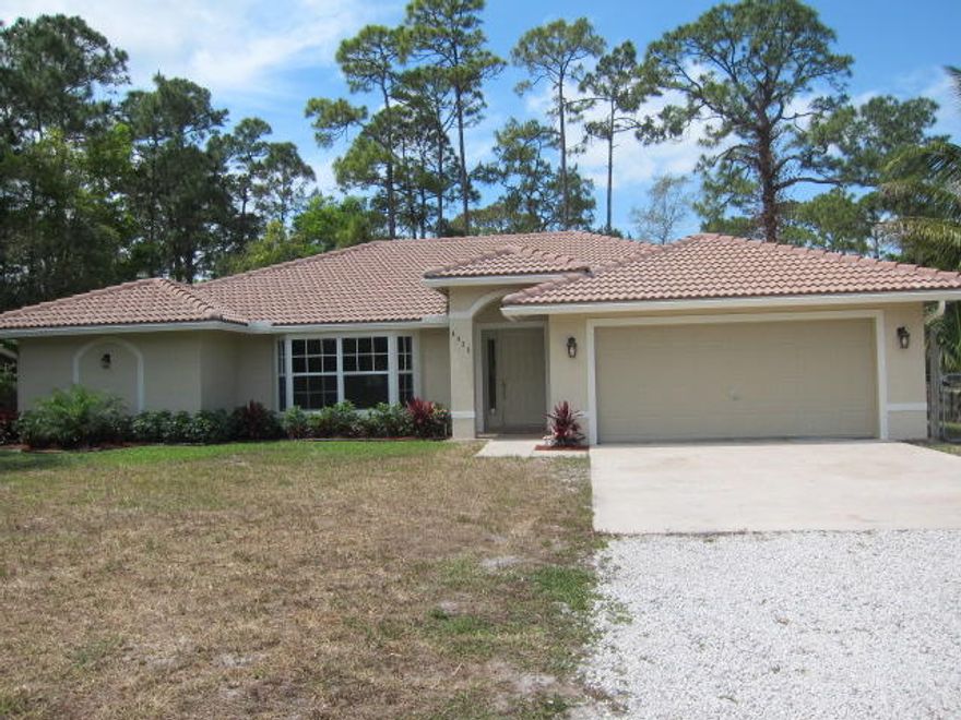 Amazing house with an extra lot . Two lots for the price of one. 2.61 acreage , The house has been totally renovated. New custom kitchen, New cabinets, granite counters thru out. New stainless steel appliances papers still inside , new washer and dryer. all flooring new, new upgraded base boards, freshly painted inside and out. New AC and Hot water heater. Both bathrooms renovated with custom designer. Nothing has been missed. Fenced in back yard. .