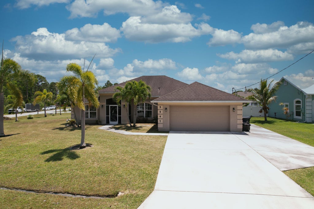 Photo of 5547 NW Cordrey Street, Port Saint Lucie, FL 34986 (MLS # R11085252)