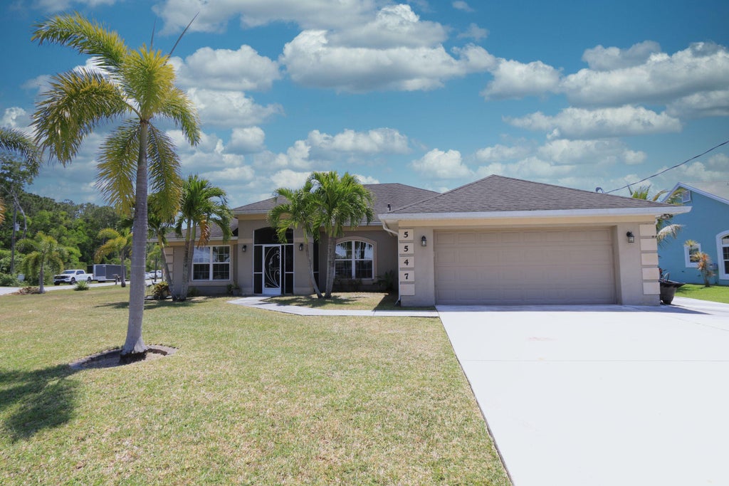 Photo of 5547 NW Cordrey Street, Port Saint Lucie, FL 34986 (MLS # R11085252)