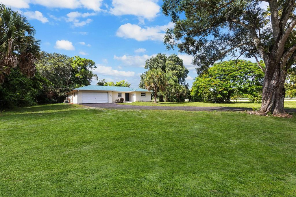 Photo of 16790 E Glasgow Drive, Loxahatchee Groves, FL 33470 (MLS # R11112401)